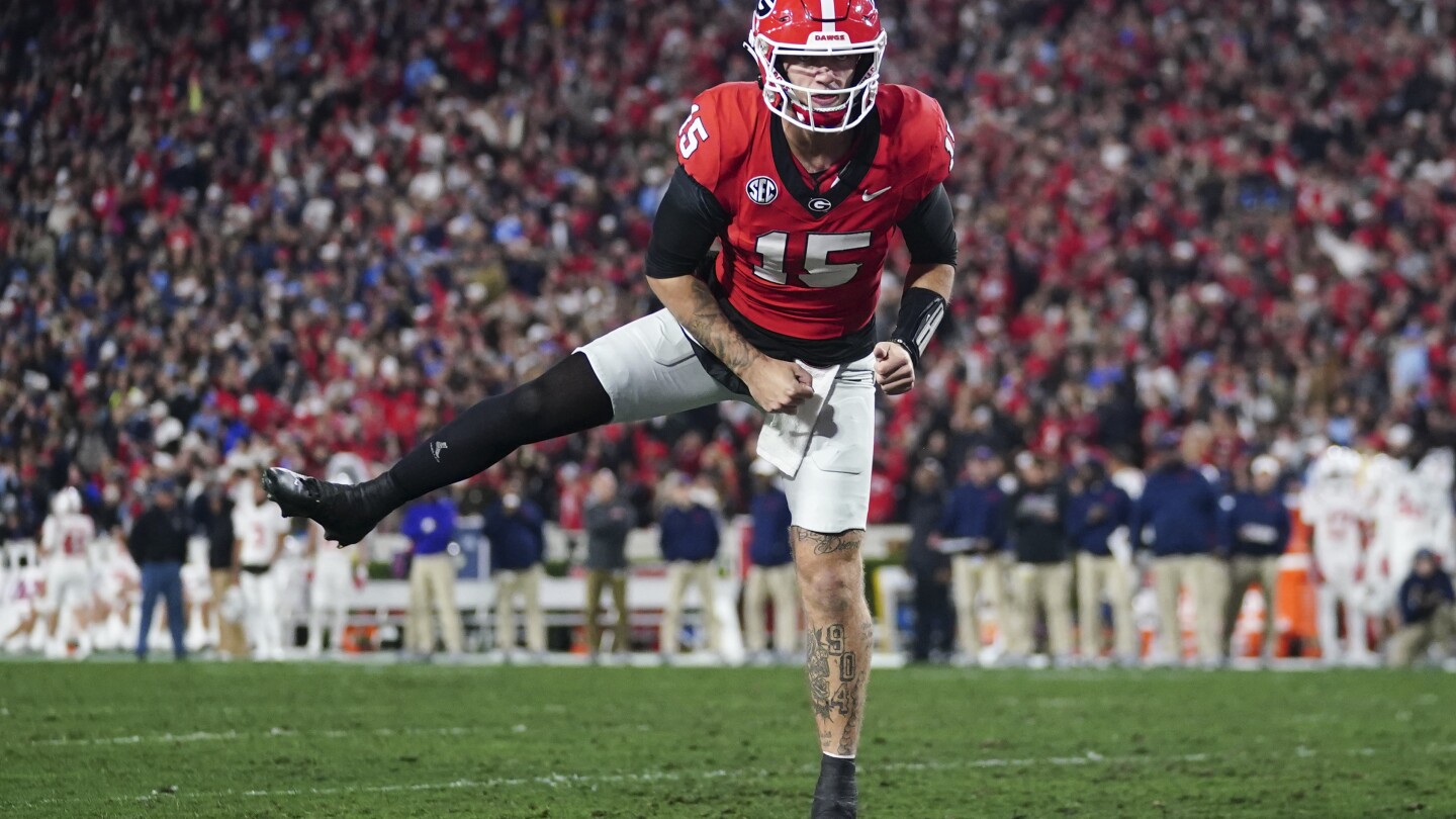 Georgia jumps to No. 1 in CFP rankings past Ohio State. Michigan and Florida State remain in top 4 | AP News