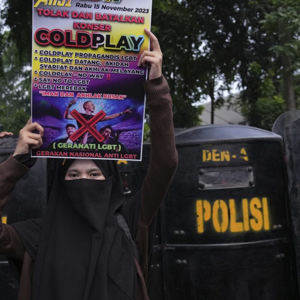 Conservative Muslims in Indonesia protest Coldplay concert over the band’s LGBTQ+ support | AP News