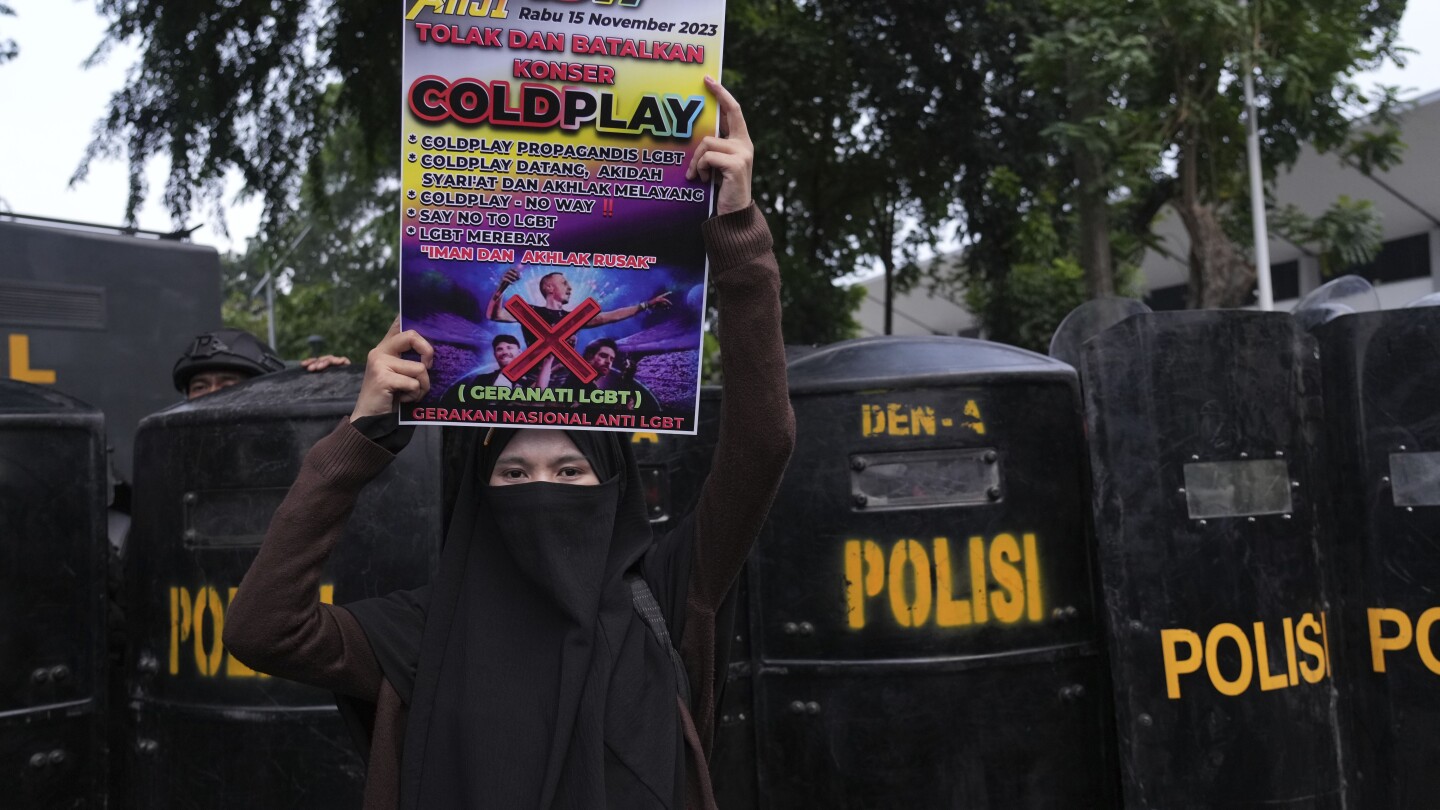 Conservative Muslims in Indonesia protest Coldplay concert over the band’s LGBTQ+ support | AP News