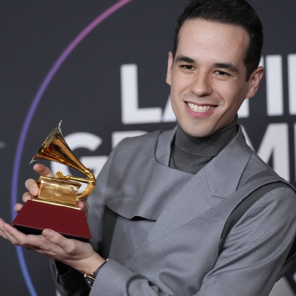 Édgar Barrera is the producer behind your favorite hits — and the Latin Grammys’ top nominee | AP News