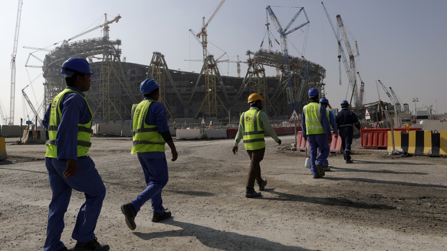 One year on from World Cup, Qatar and FIFA urged by rights group to do more for migrant workers | AP News