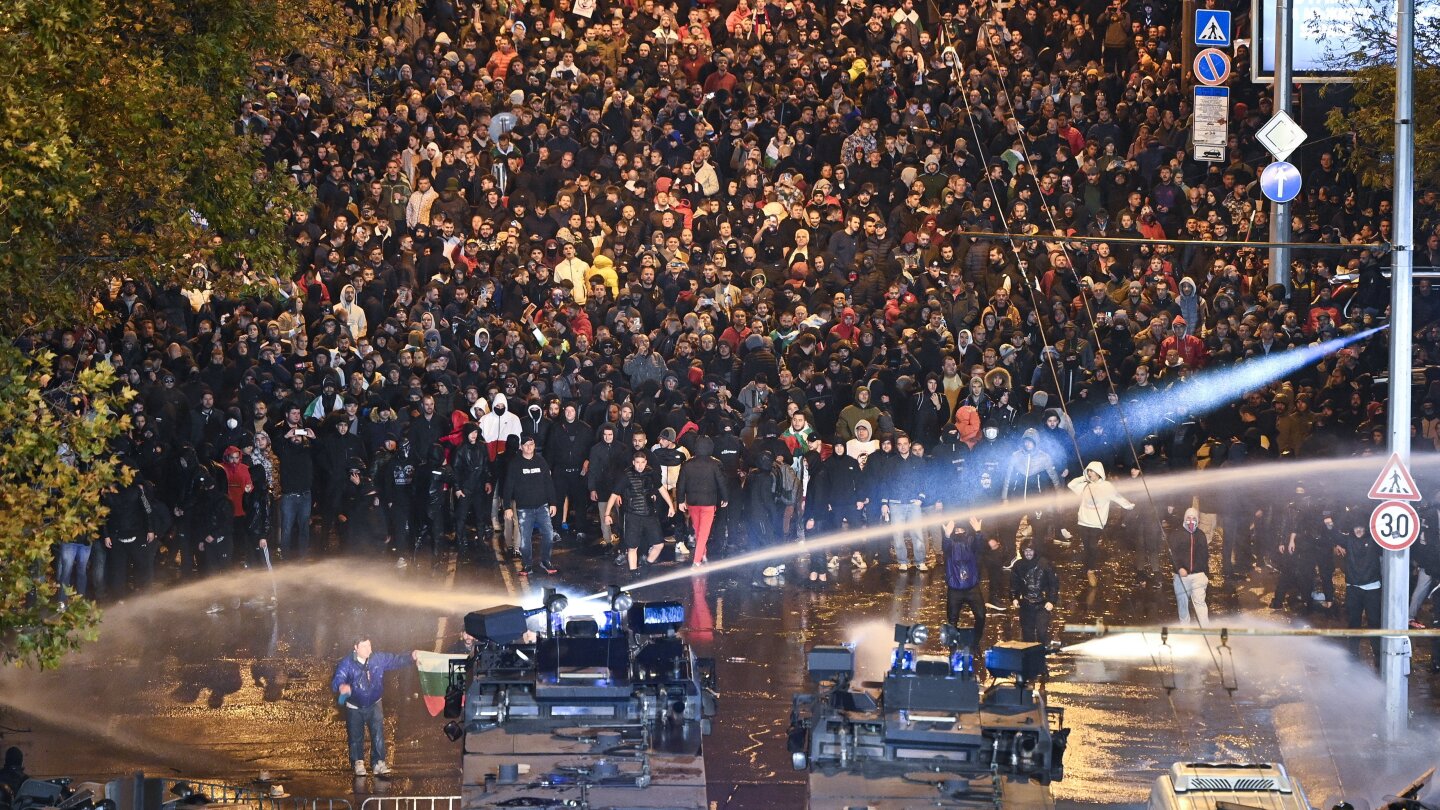 Hungary qualifies for Euro 2024 with own-goal in stoppage time in match marred by violence | AP News