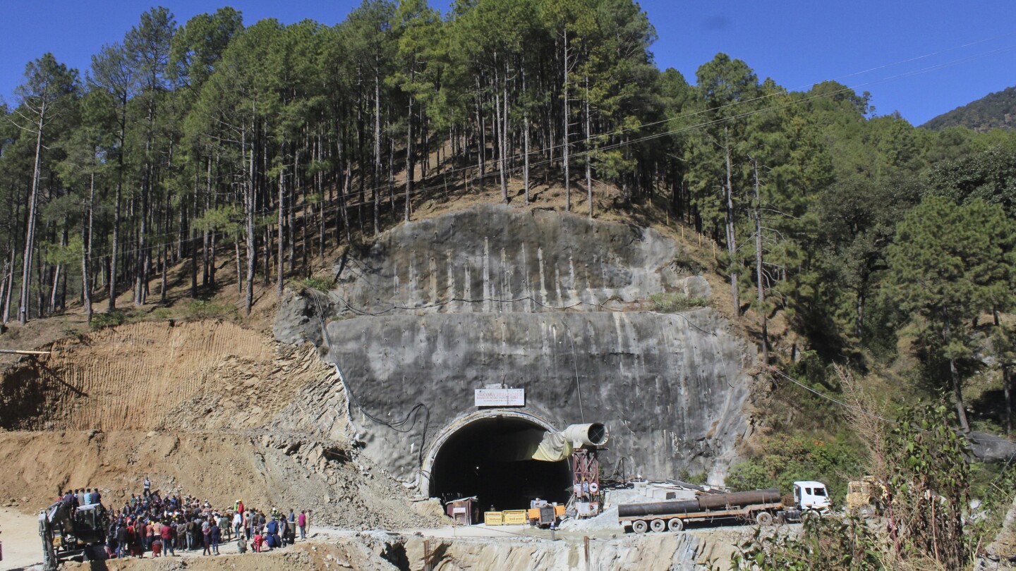 India tunnel collapse: Rescuers drill deeper to create escape pipe for trapped workers | AP News