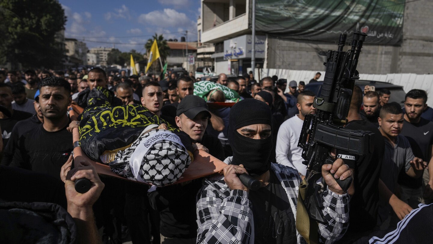 Israeli troops kill 5 Palestinians, including 3 militants, as West Bank violence surges | AP News