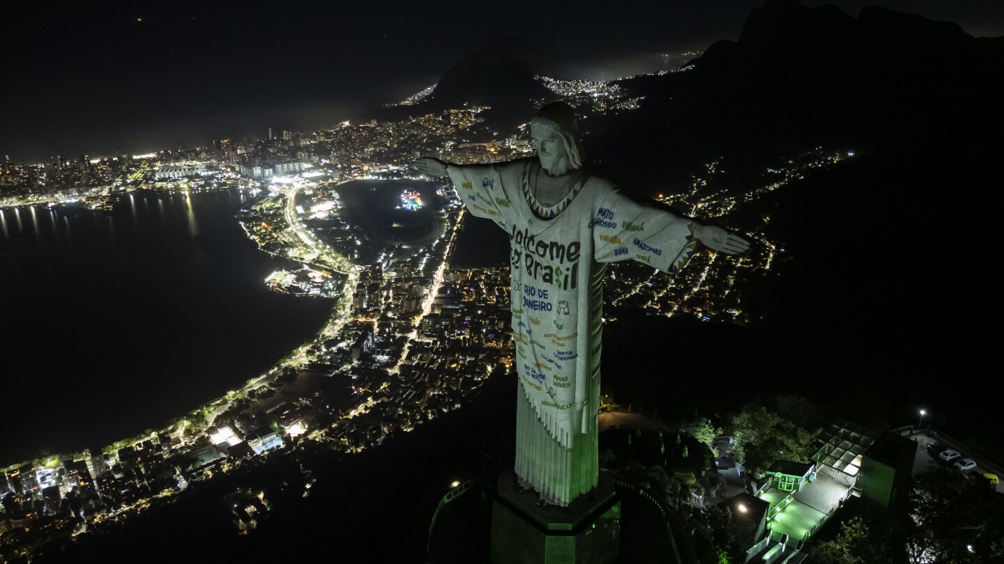 Rio’s iconic Christ statue welcomes Taylor Swift with open arms thanks to Swifties and a priest | AP News