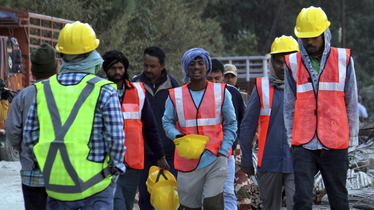 India tunnel collapse: Rescuers wait for new drill to create escape for trapped workers | AP News