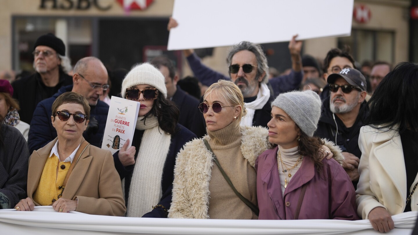 French performers lead a silent Paris march for peace between Israelis and Palestinians | AP News