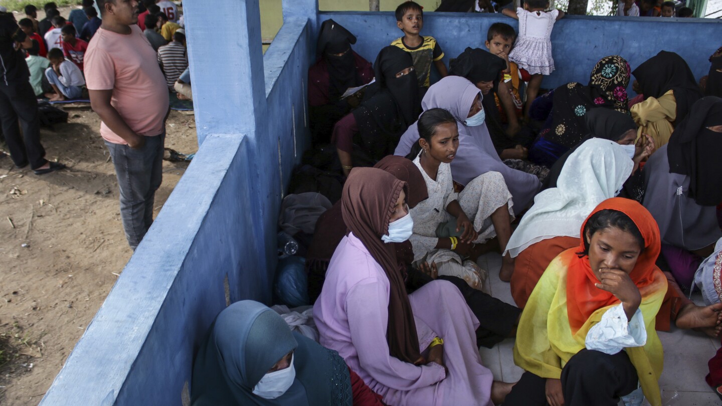 Nearly 1,000 Rohingya refugees arrive by boat in Indonesia’s Aceh region in one week | AP News