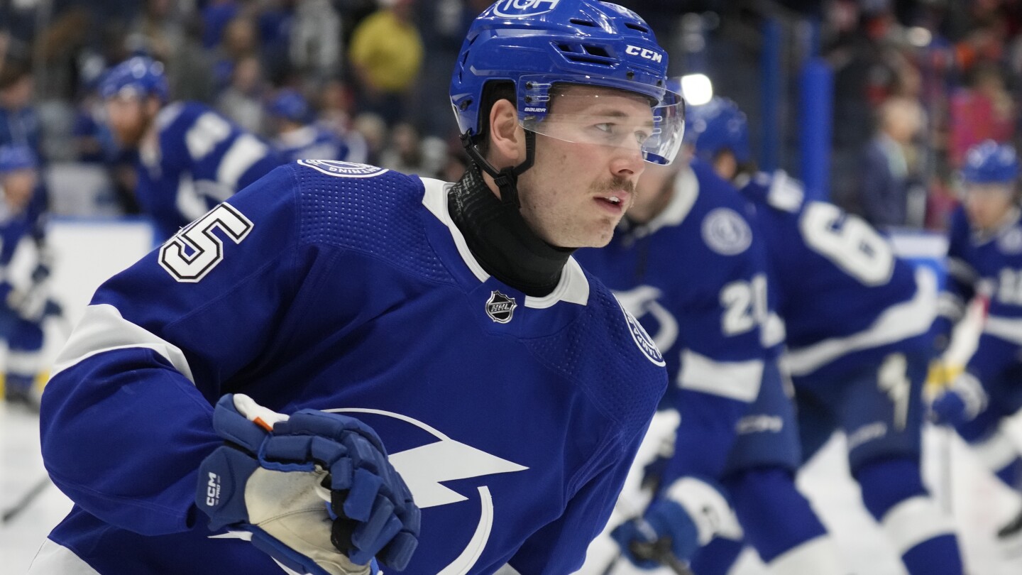 Lightning left wing Cole Koepke wearing neck guard following the death of Adam Johnson | AP News