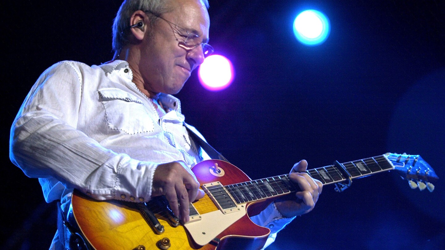 Dire Straits frontman Mark Knopfler is putting some of his guitars up for auction | AP News