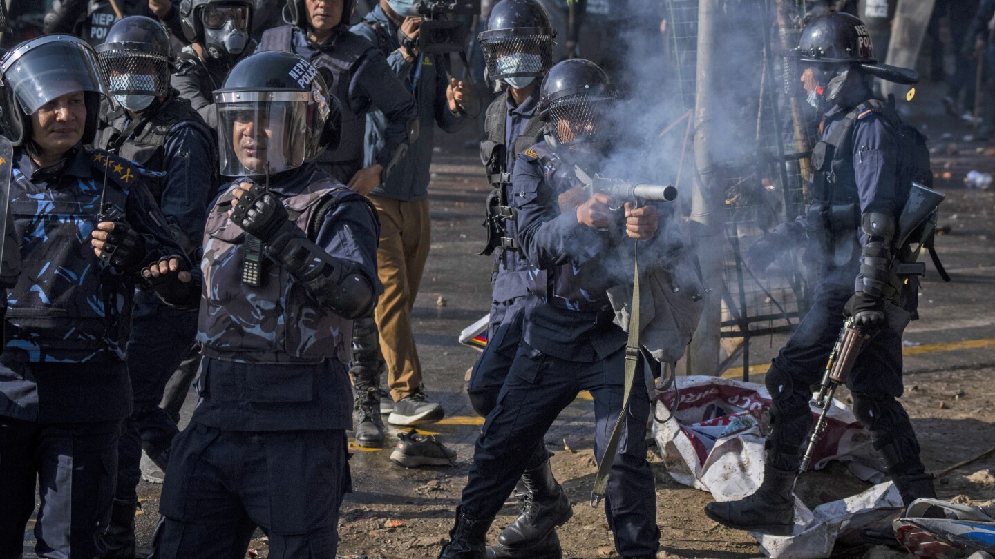 Tens of thousands of protesters demanding a restoration of Nepal’s monarchy clash with police | AP News