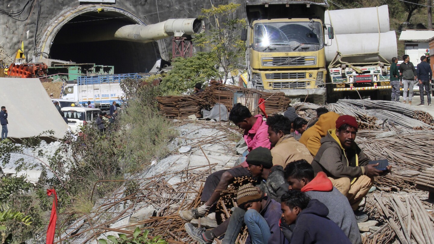 Rescuers in India hope to resume drilling to evacuate 41 trapped workers after mechanical problem | AP News