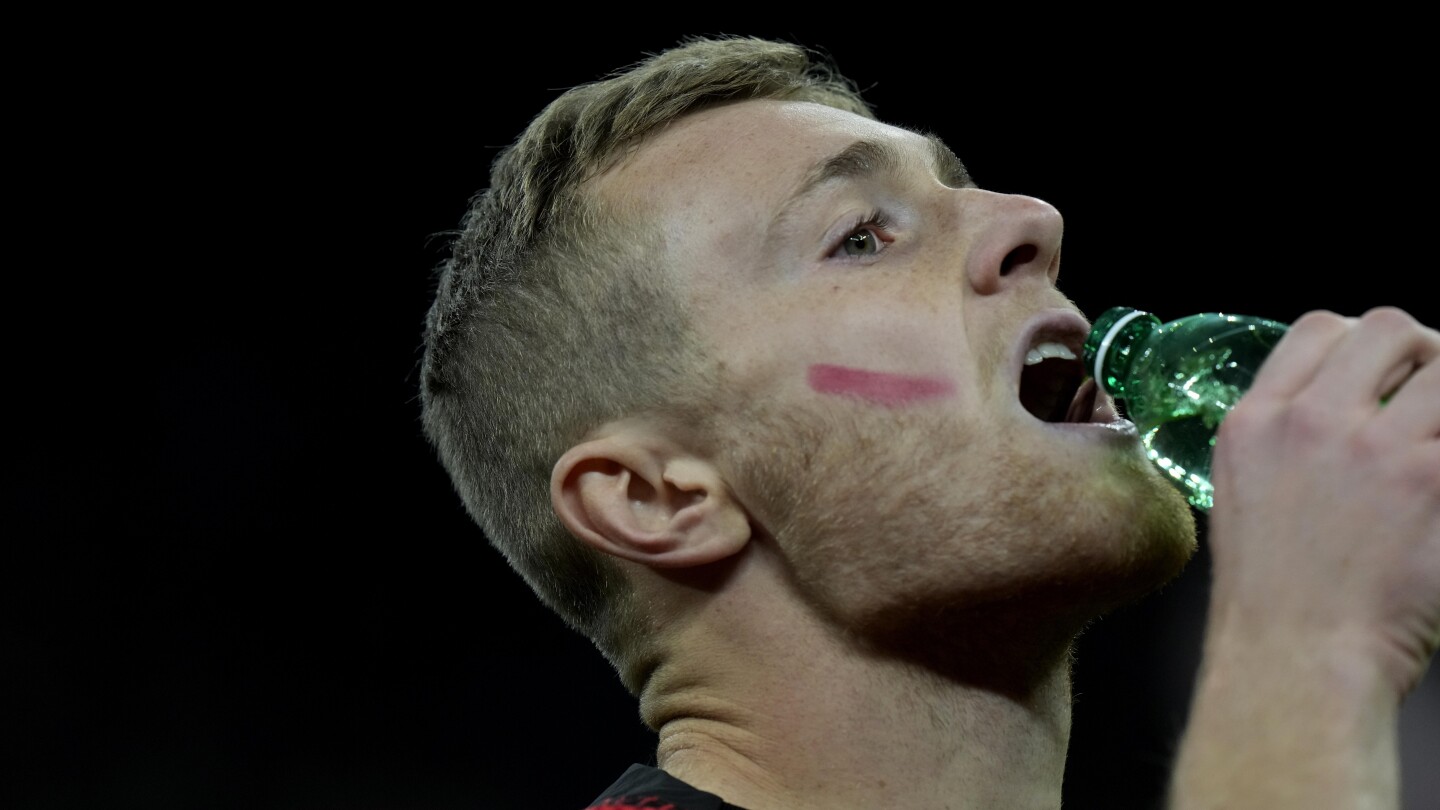 Male soccer players in Italy put red marks on faces in campaign to eliminate violence against women | AP News