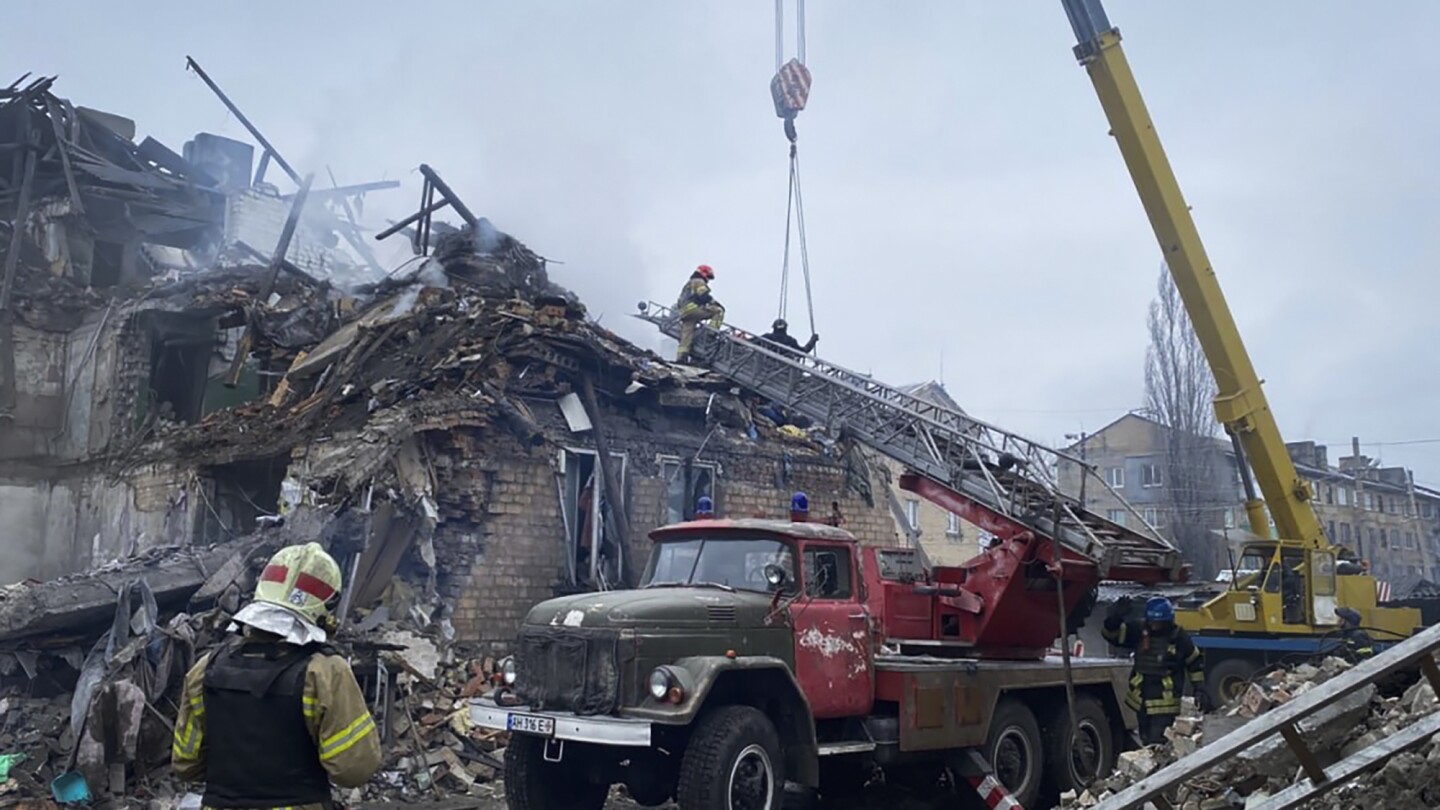 Russian missile strikes in eastern Ukraine tear through buildings and bury families in rubble | AP News