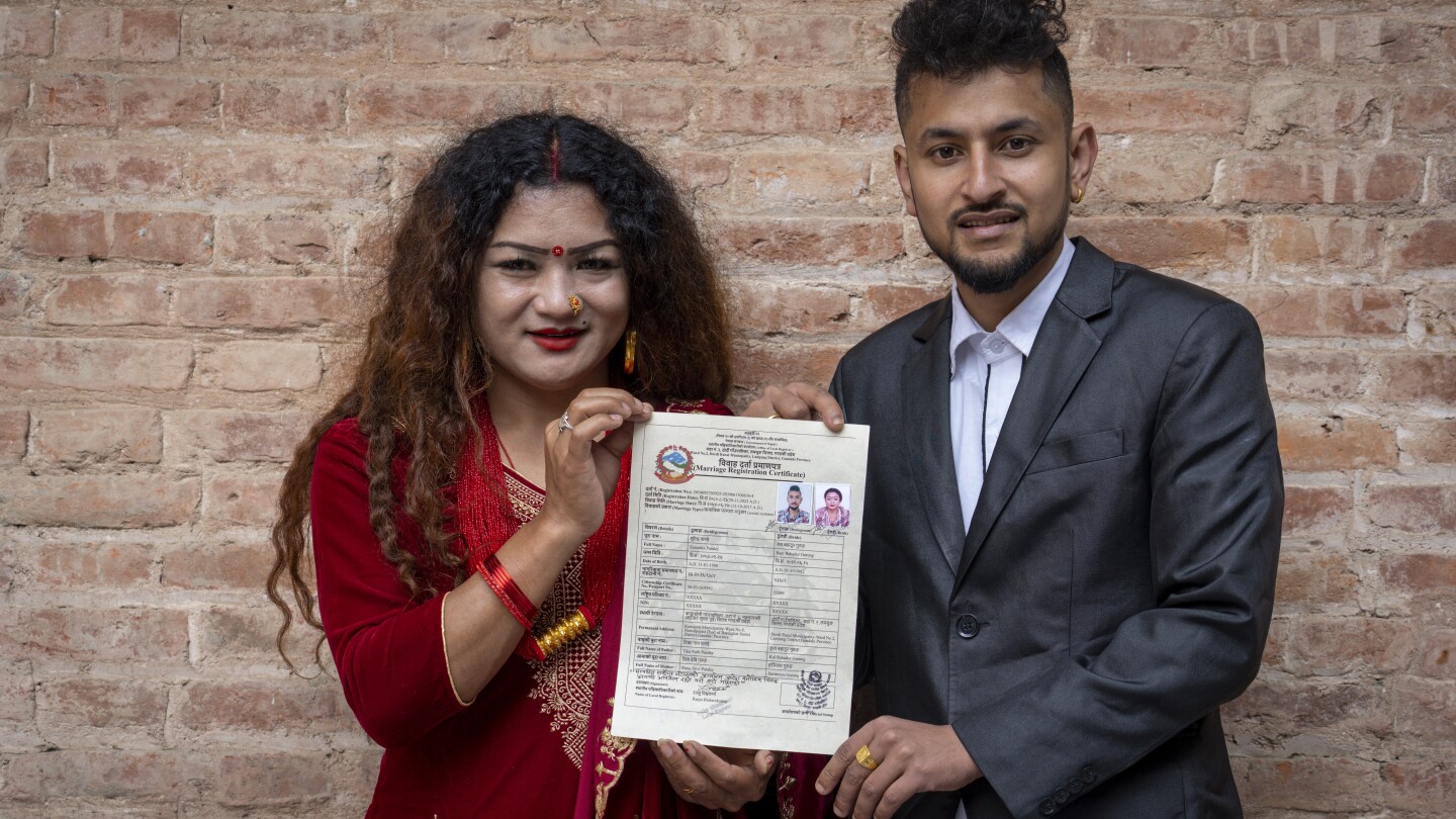 First same-sex married couple in Nepal vow to continue campaign for gay rights | AP News