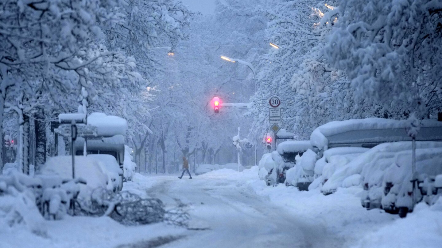 A snowstorm brings Munich airport to a standstill and causes travel chaos in Germany | AP News