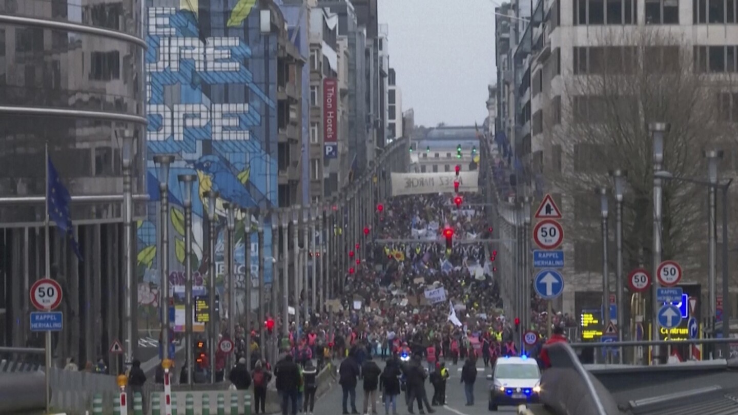 Thousands of climate change activists hold boisterous protest march in Brussels with serious message | AP News