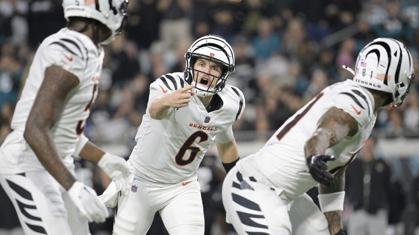 Jake Browning steals spotlight as Bengals stun Jaguars 34-31 in OT. Trevor Lawrence injures ankle | AP News