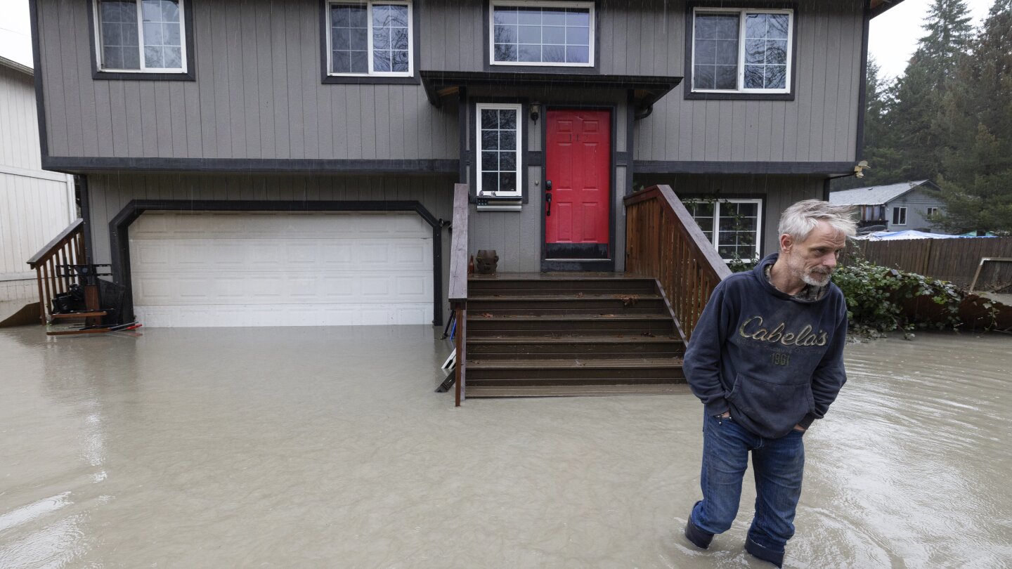 Atmospheric river soaks Pacific Northwest with record-breaking rain and unusually warm temperatures | AP News