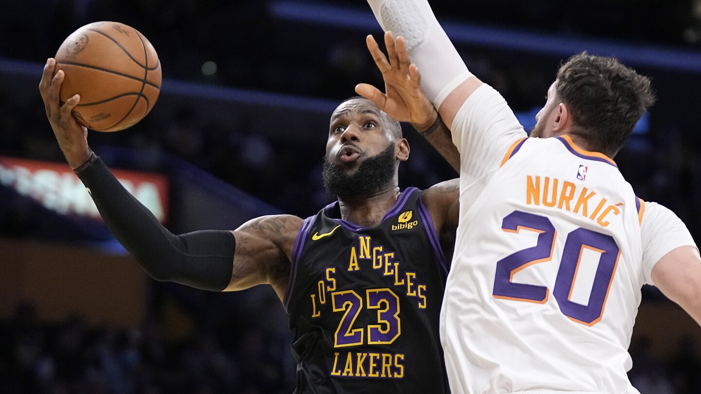 LeBron James leads Lakers to the In-Season Tournament semifinals with a 106-103 win over Suns | AP News