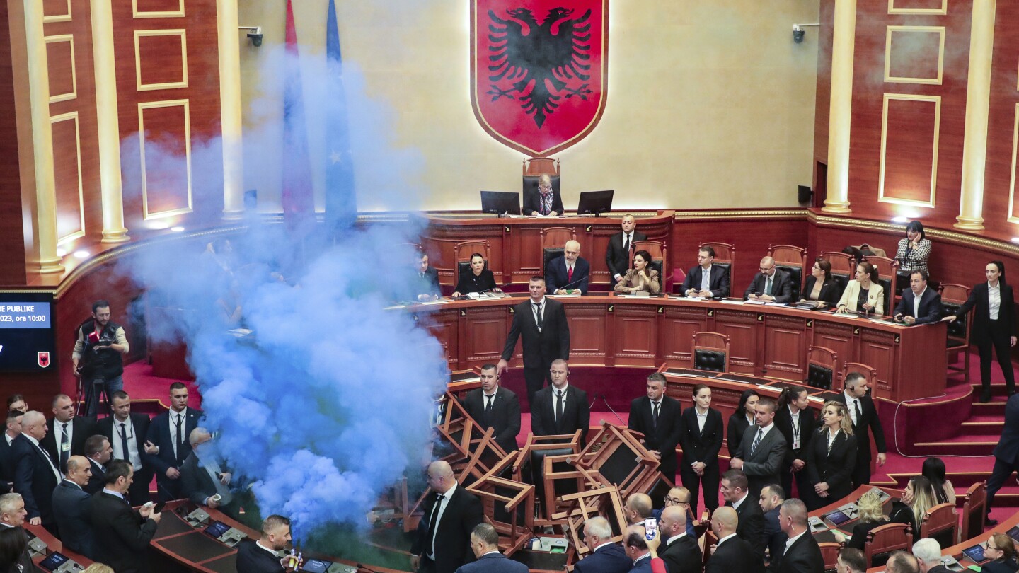 Why the Albanian opposition is disrupting parliament with flares, makeshift barricades and fires | AP News