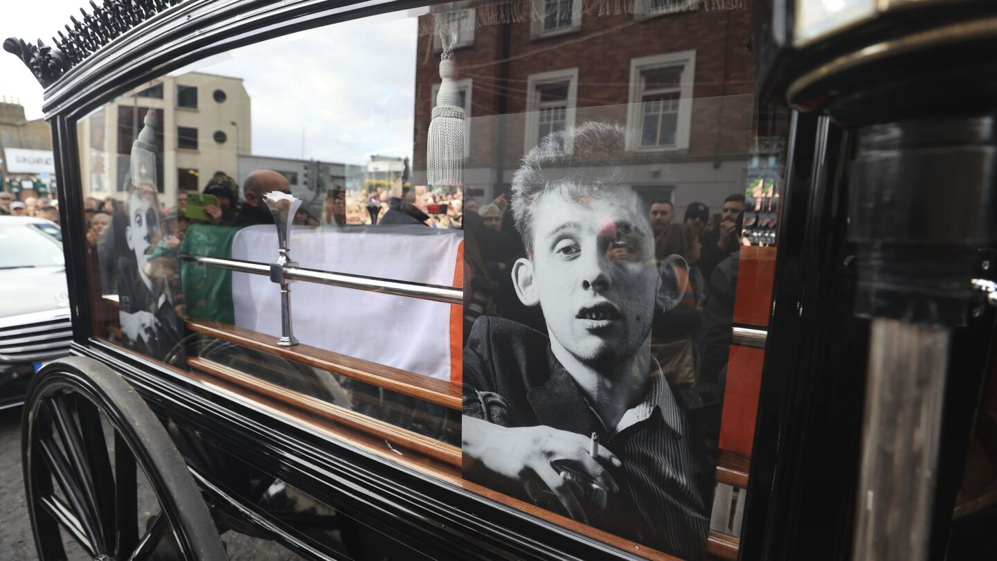 Crowds line Dublin streets for funeral procession of The Pogues singer Shane MacGowan | AP News