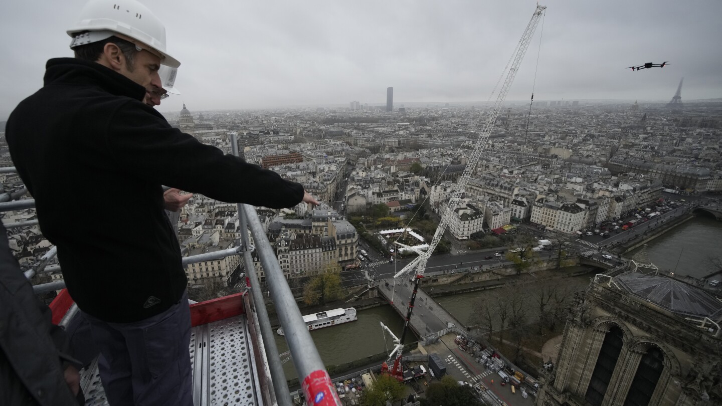 Macron visits Notre Dame, marking 1-year countdown to reopening after the 2019 fire | AP News