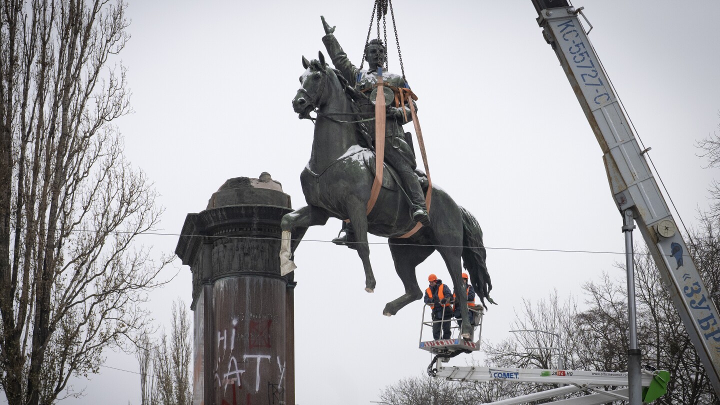 A Soviet-era statue of a Red Army commander taken down in Kyiv | AP News