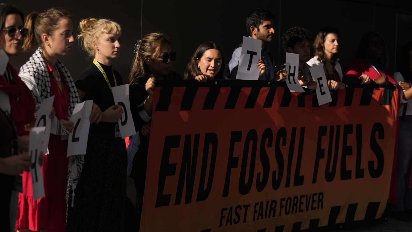 As COP28 negotiators wrestle with fossil fuels, activists urge them to remember what’s at stake | AP News