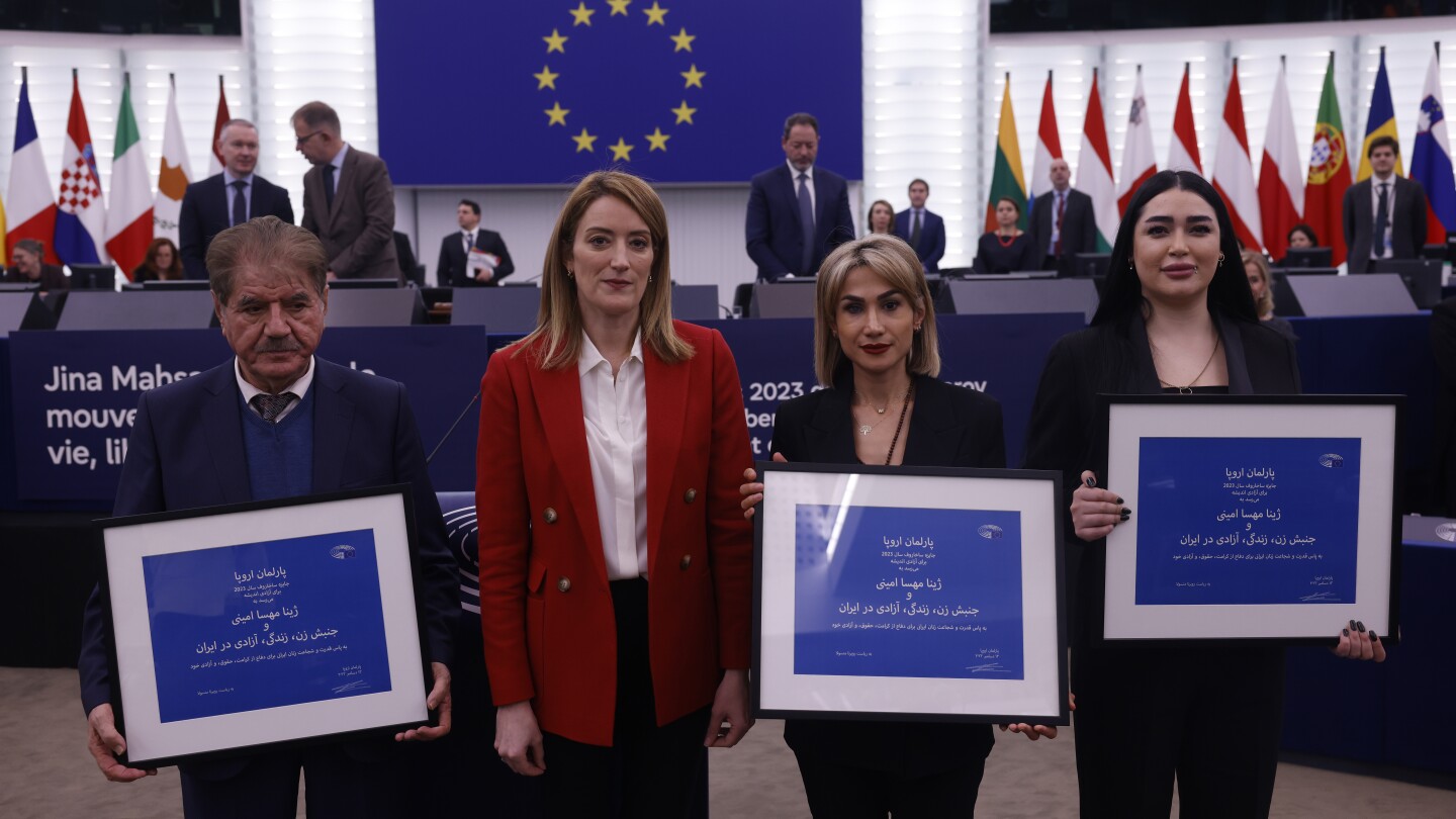 EU remembers Iranian woman who died in custody at awarding of Sakharov human rights prize | AP News