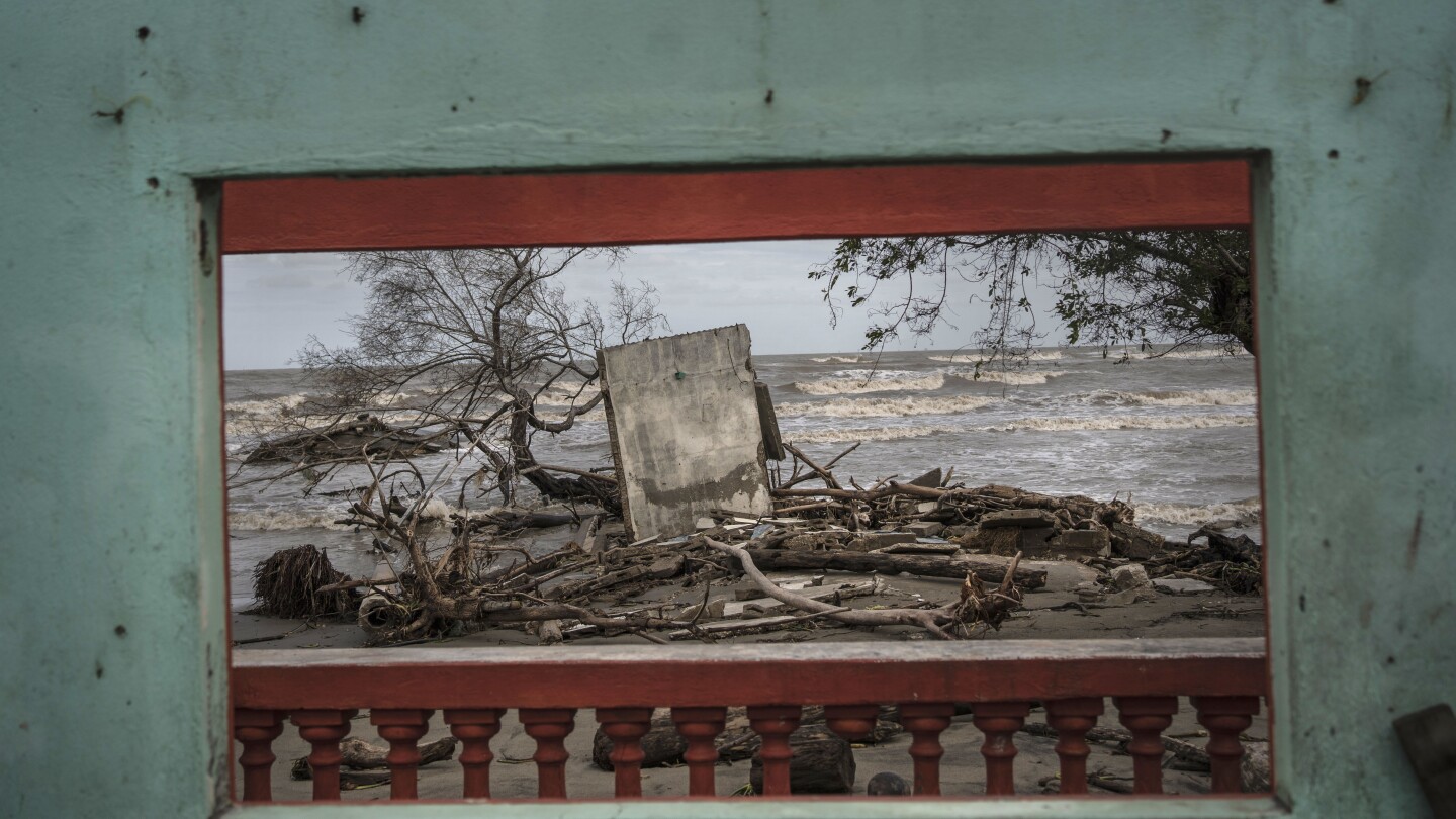 The last residents of a coastal Mexican town destroyed by climate change | AP News