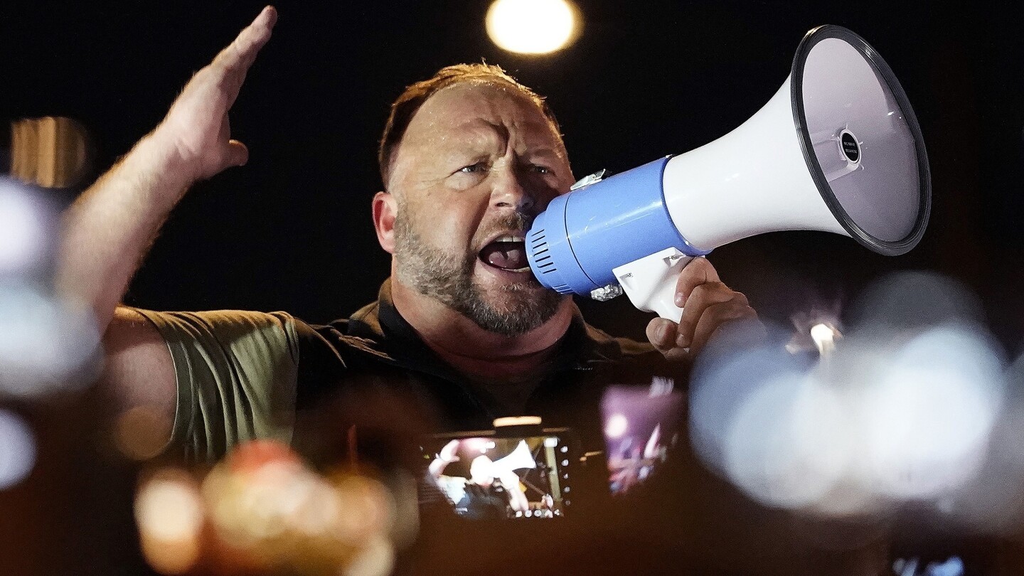 Alex Jones offers to pay Newtown families at least $55 million over school shooting hoax conspiracy | AP News