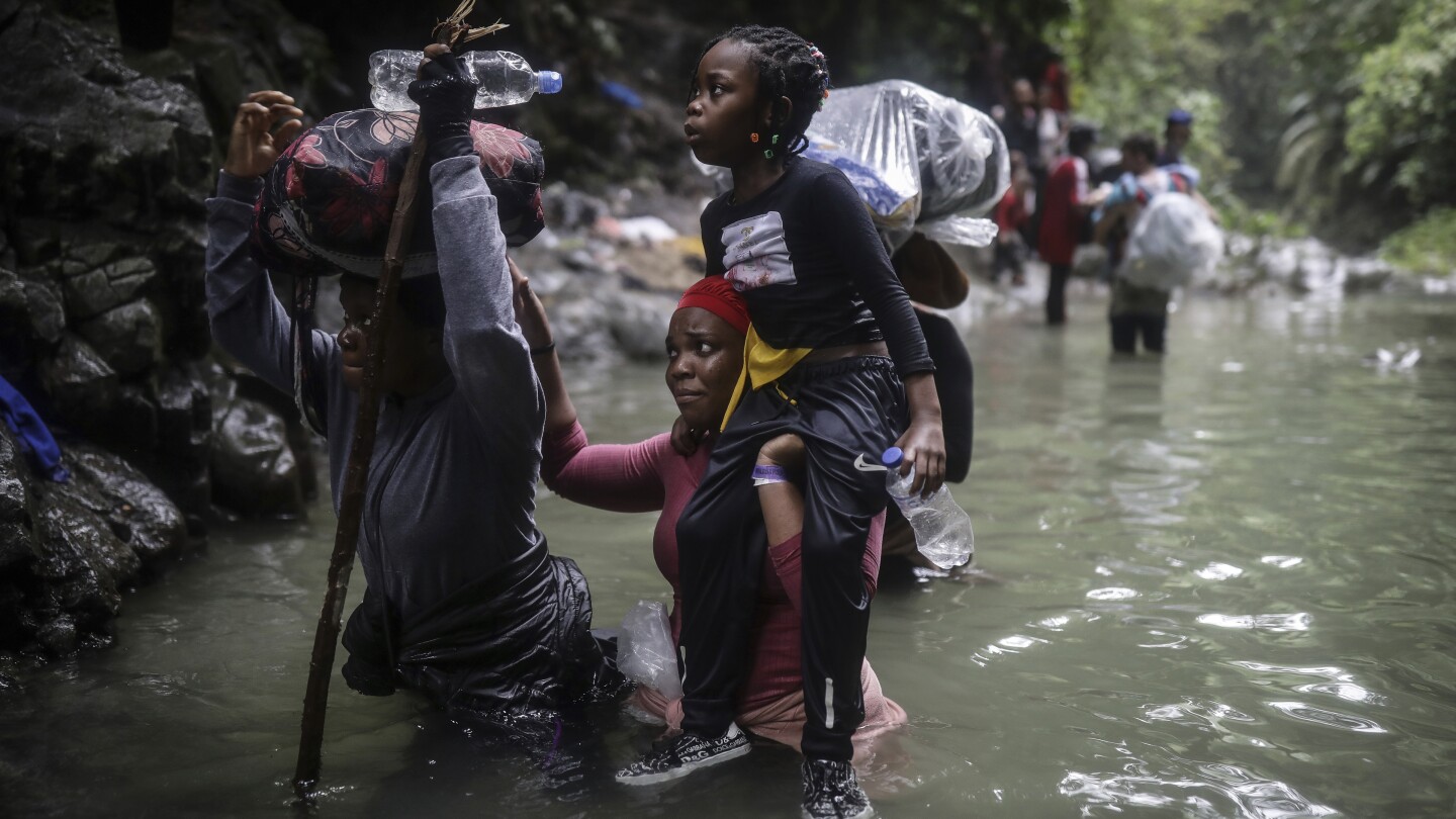 Jungle between Colombia and Panama becomes treacherous highway for migrants | AP News