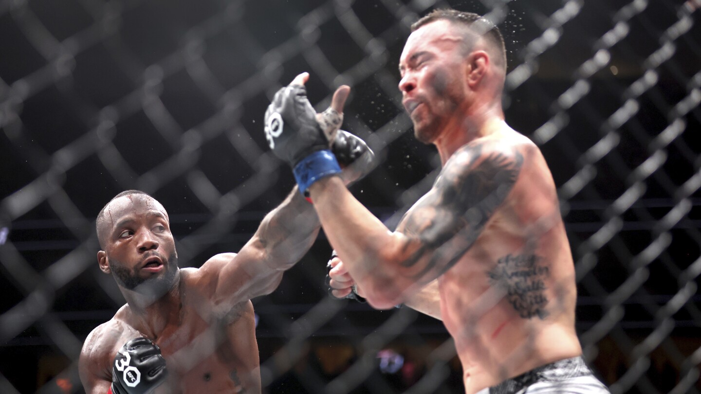 Leon Edwards retains welterweight belt with unanimous decision over Colby Covington at UFC 296 | AP News