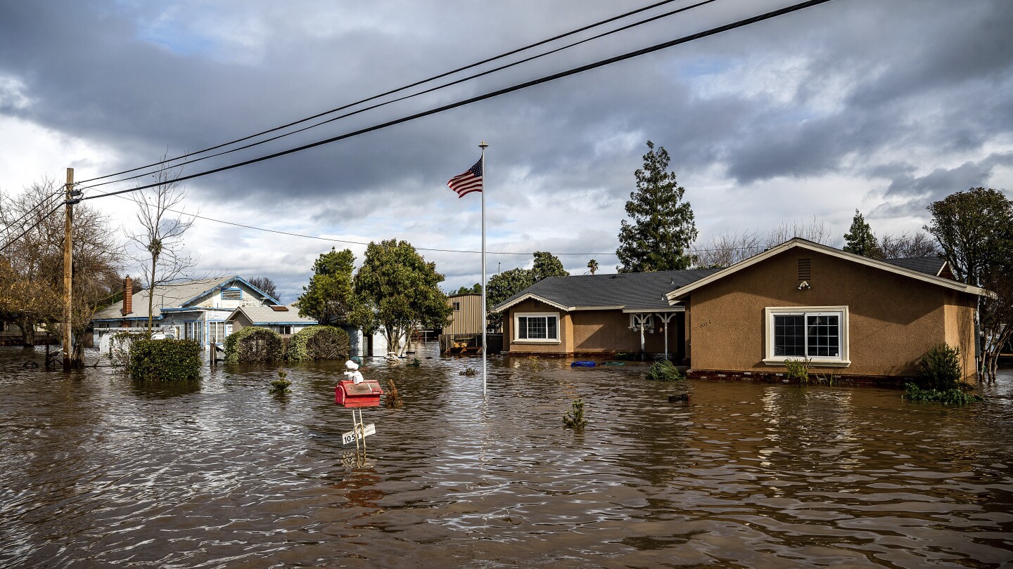 Flooding drives millions to move as climate-driven migration patterns emerge | AP News