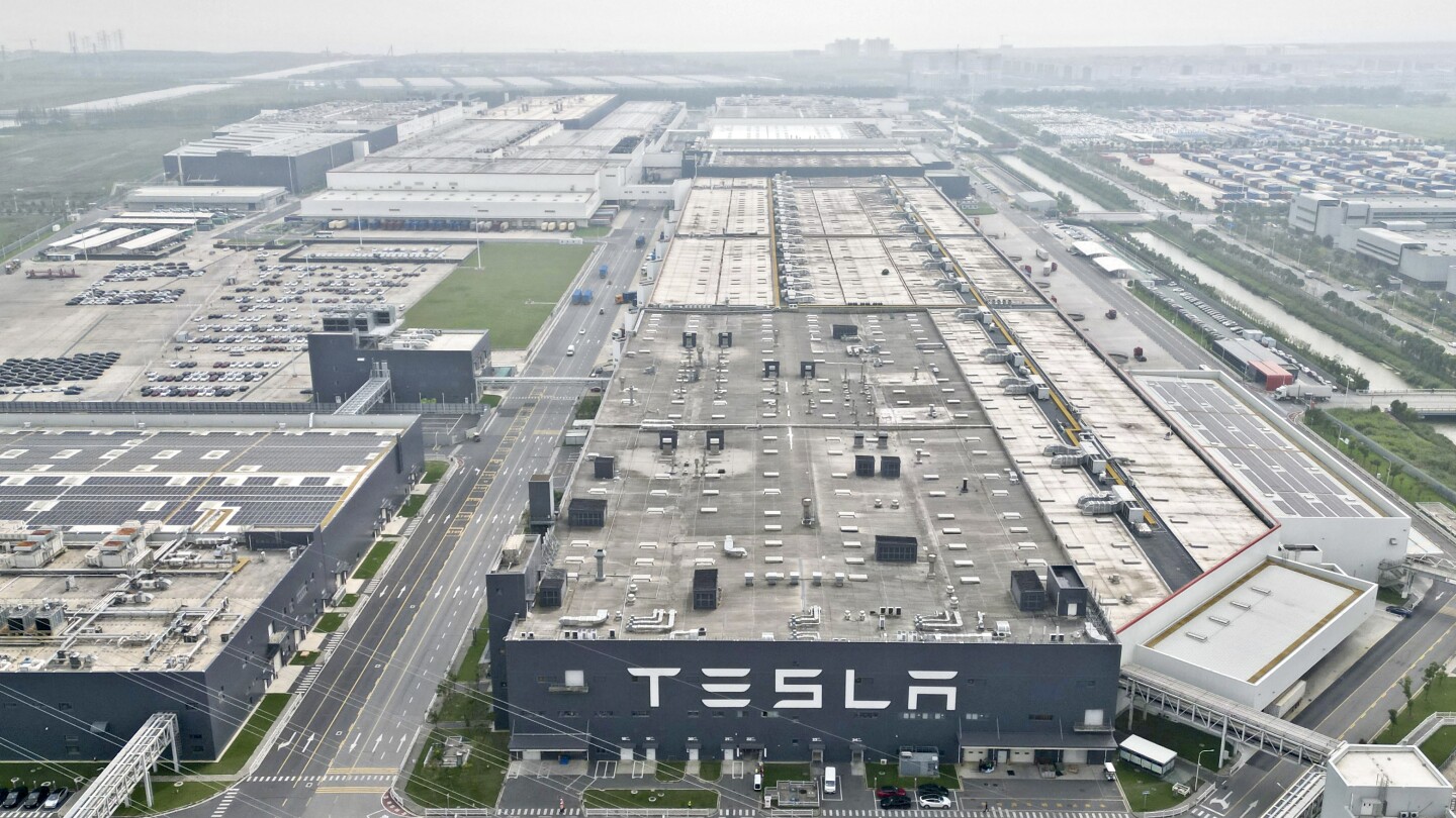 Tesla moves forward with a plan to build an energy-storage battery factory in China | AP News