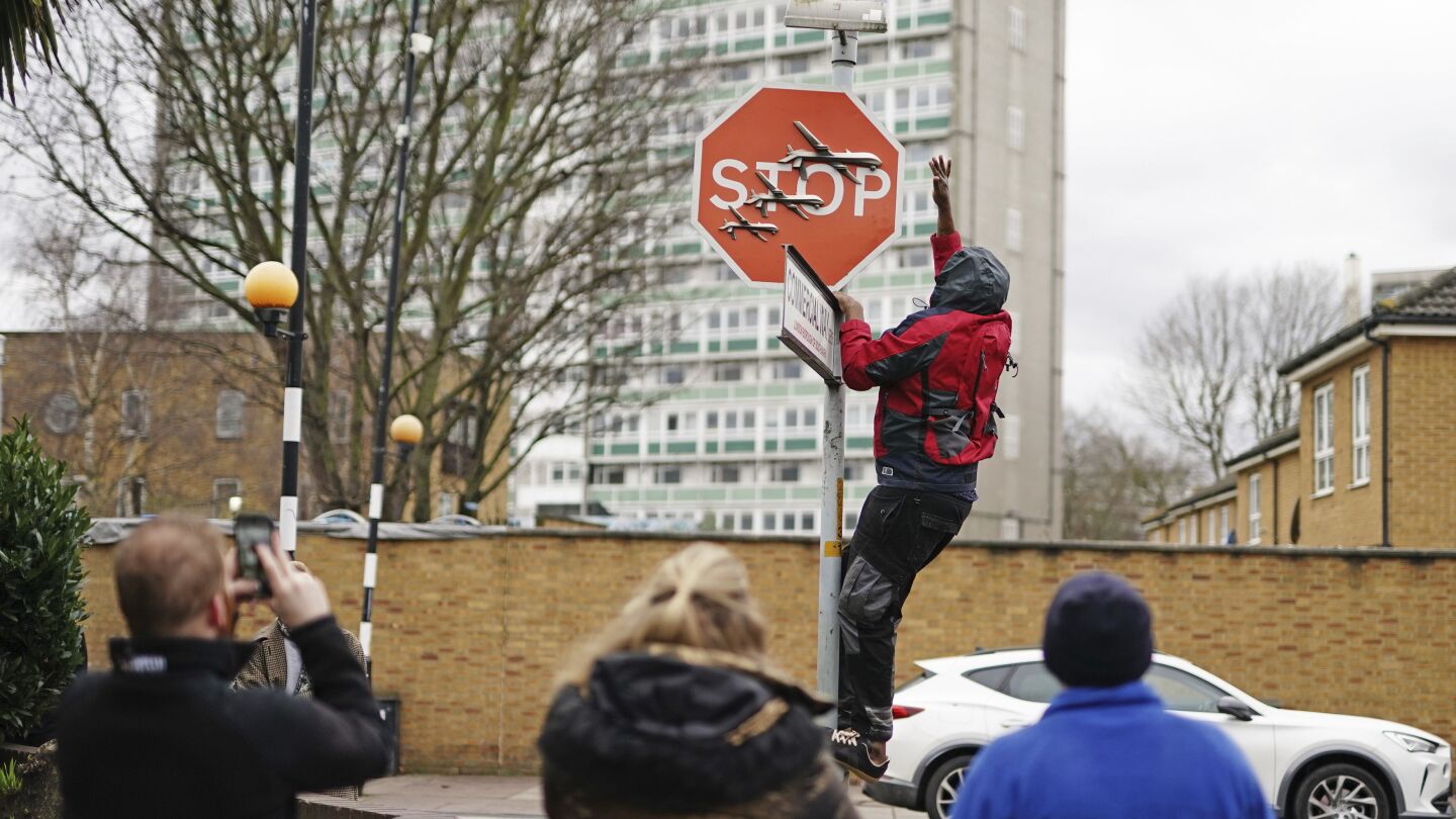 Now you see it, now you don’t: Banksy stop sign taken from London street soon after it appears | AP News