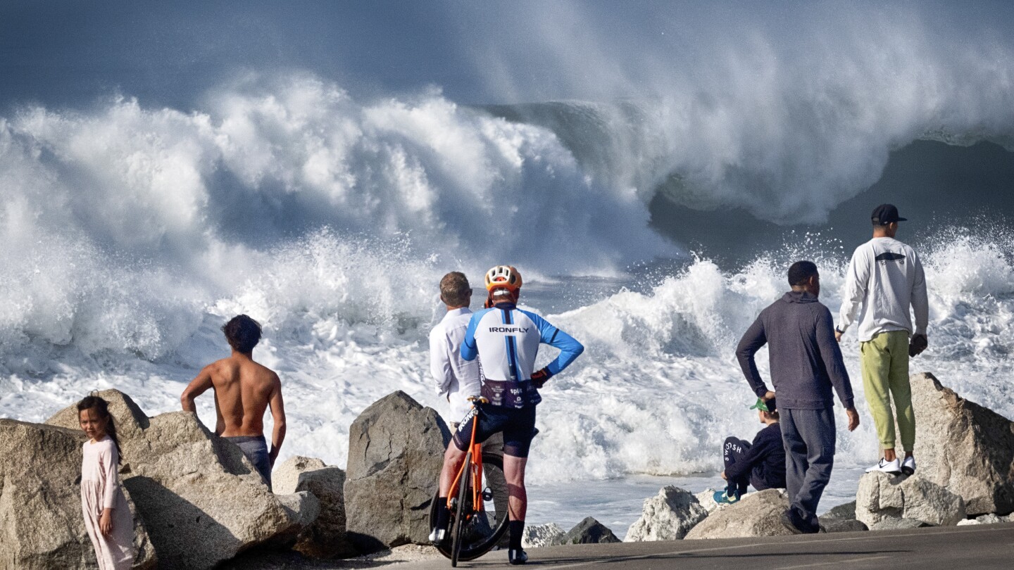 Huge surf pounds California coast and Hawaii, flooding some areas | AP News