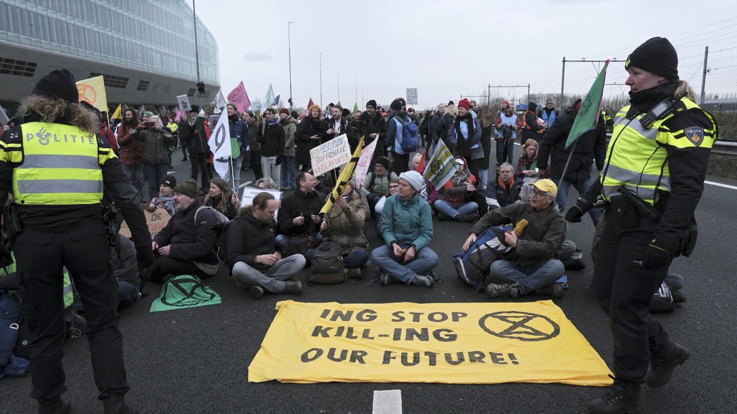 Climate activists from Extinction Rebellion have blocked part of the highway around Amsterdam | AP News