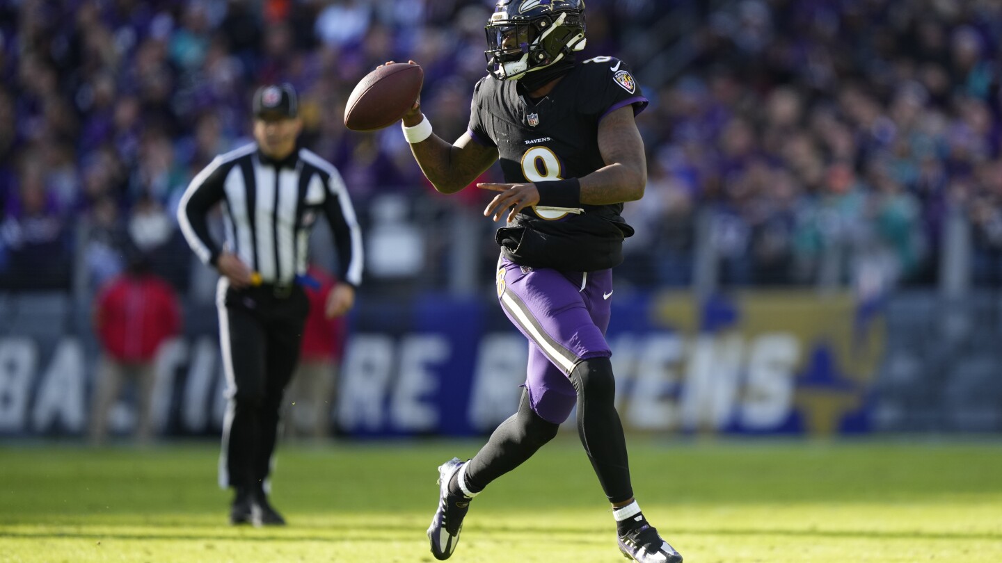 Lamar Jackson’s perfect day clinches top seed in AFC for Ravens, fuels rout of Dolphins | AP News