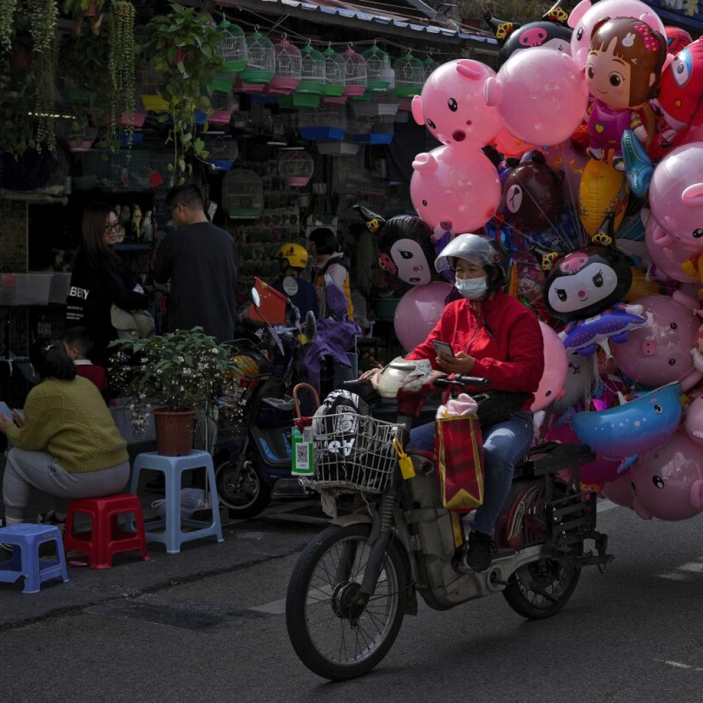 Chinese factory activity slows in December in a 3rd straight month of contraction | AP News