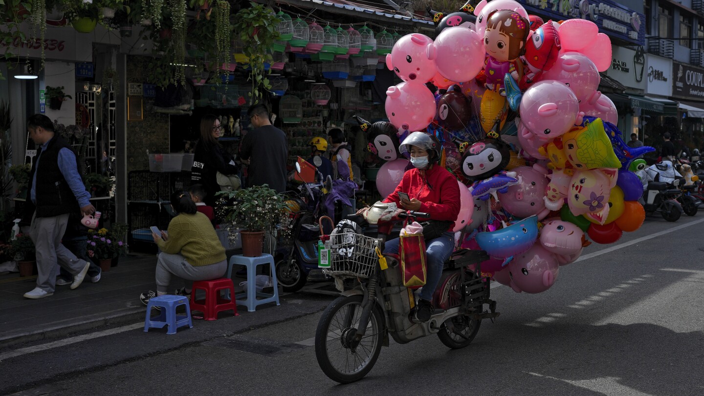 Chinese factory activity slows in December in a 3rd straight month of contraction | AP News