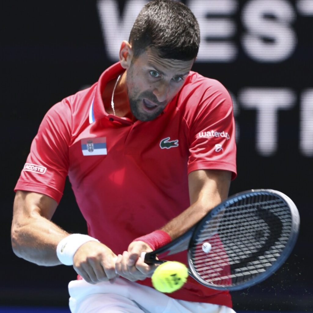 Djokovic and his sore right wrist advance Serbia to likely United Cup quarterfinals in Perth | AP News