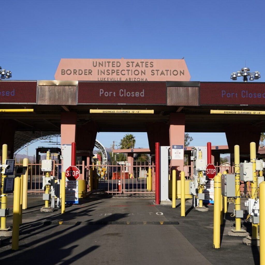 Arizona border crossing to reopen a month after migrant influx forced closure | AP News