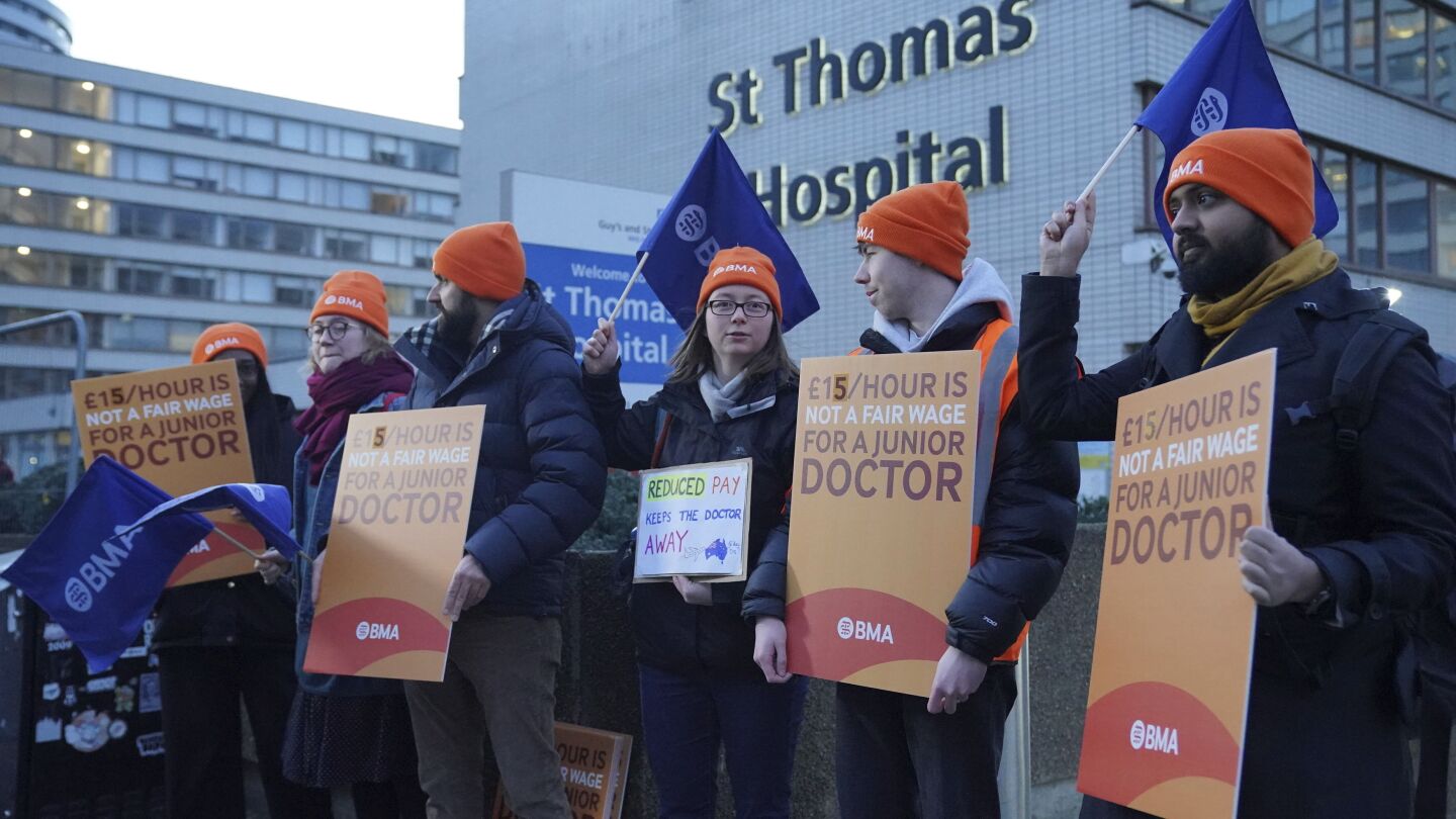 Thousands of doctors in Britain walk off the job in their longest-ever strike | AP News