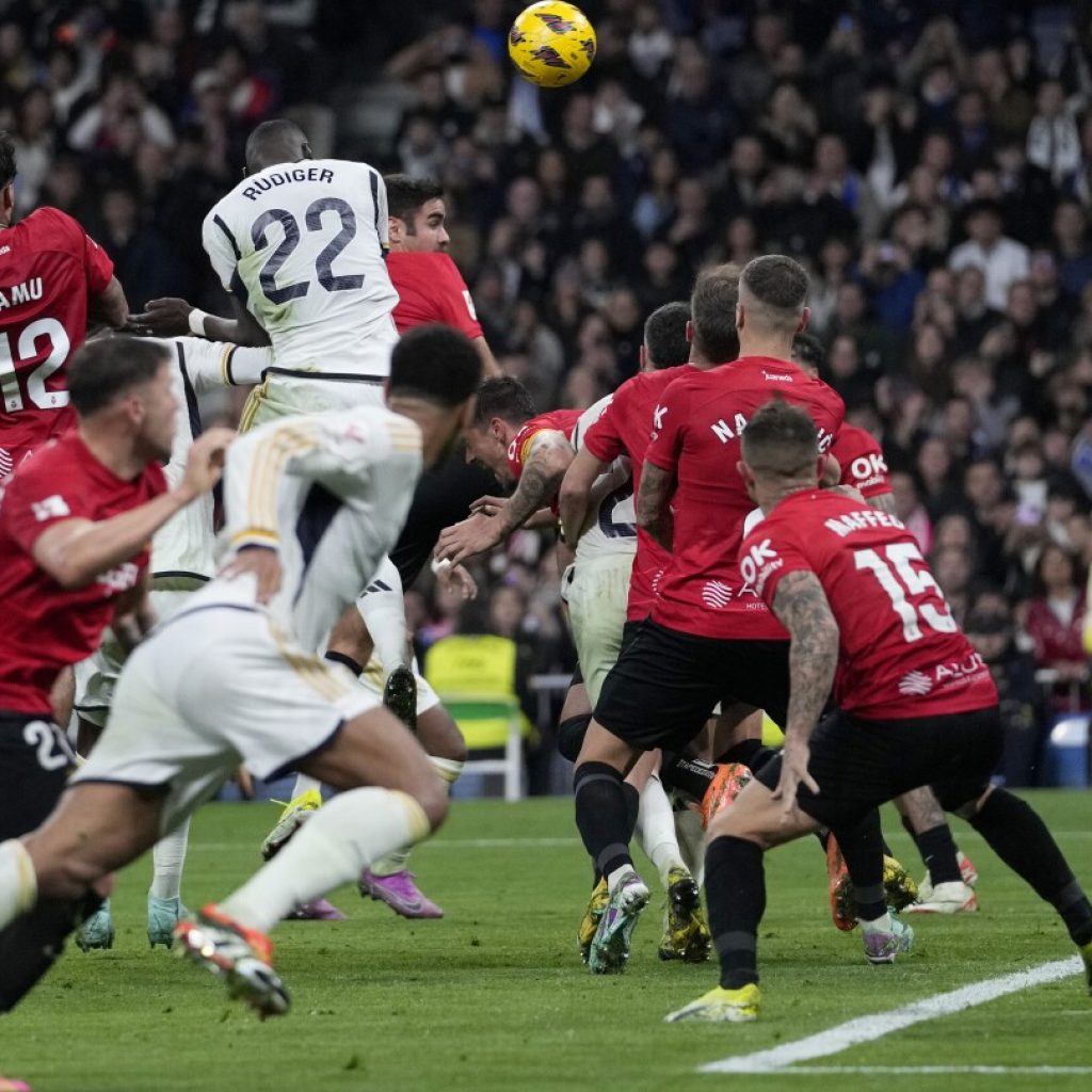 Madrid edges Mallorca 1-0 and Girona beats Atletico 4-3 to stay at the top at halfway point in Spain | AP News