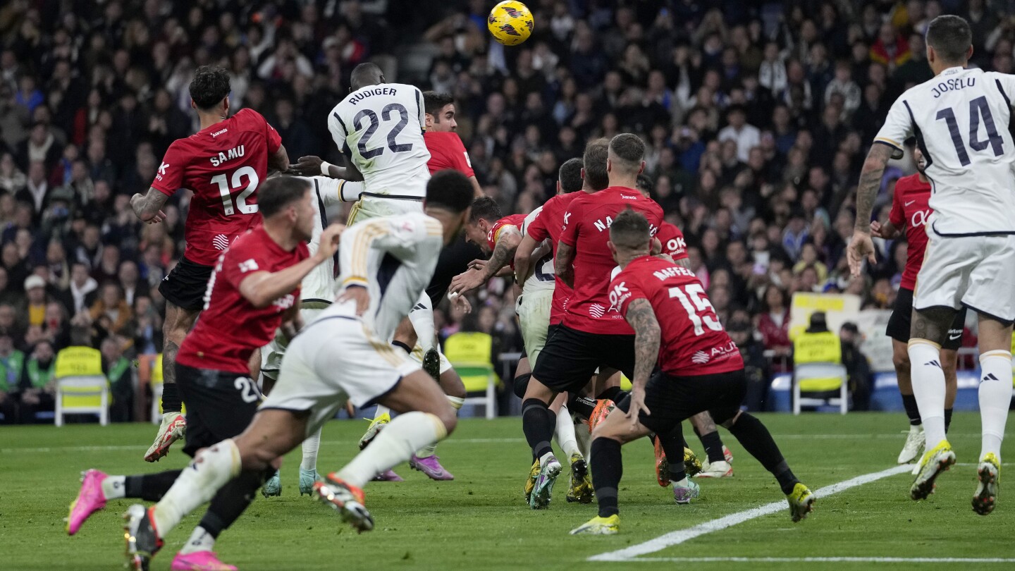 Madrid edges Mallorca 1-0 and Girona beats Atletico 4-3 to stay at the top at halfway point in Spain | AP News