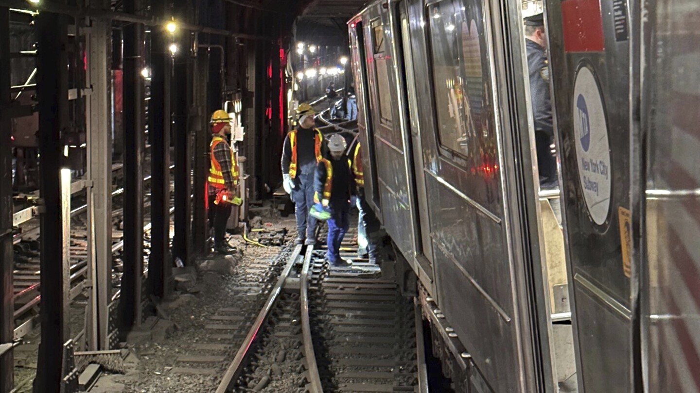 New York City subway train derailment injures more than 20 people | AP News