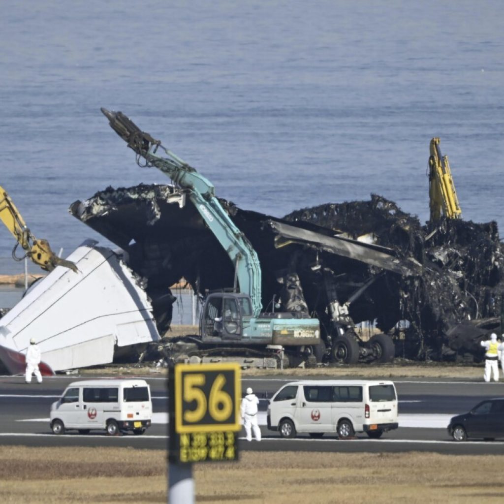 Japan plane crash: Air safety experts search for voice data from debris | AP News