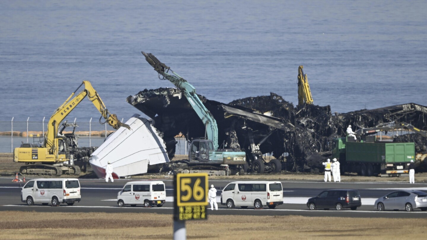 Japan plane crash: Air safety experts search for voice data from debris | AP News